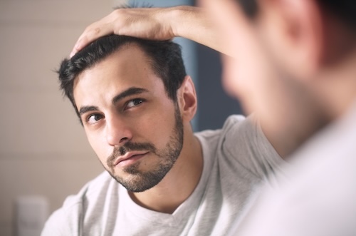 Latino,Person,With,Beard,Grooming,In,Bathroom,At,Home.,White